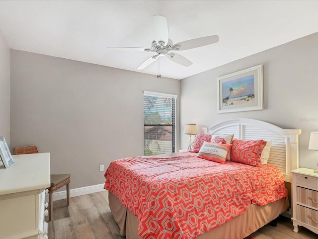 bedroom featuring light hardwood / wood-style floors and ceiling fan