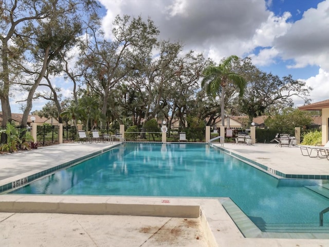 view of swimming pool with a patio area