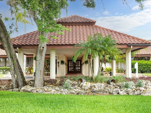 rear view of house featuring french doors