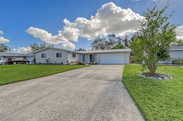 single story home with a garage and a front lawn