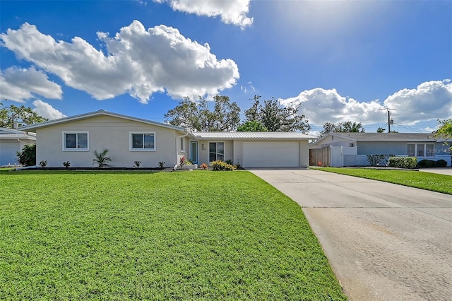 ranch-style house with a garage and a front yard