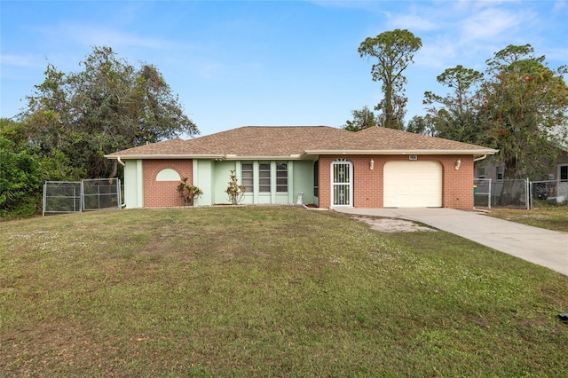 single story home with a garage and a front lawn