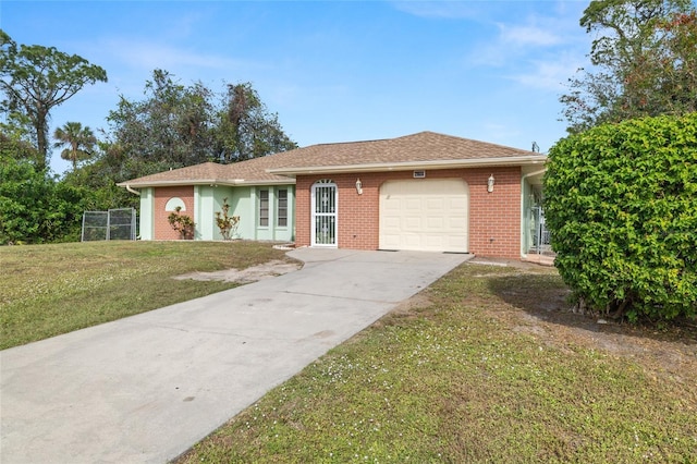 single story home featuring a garage and a front yard