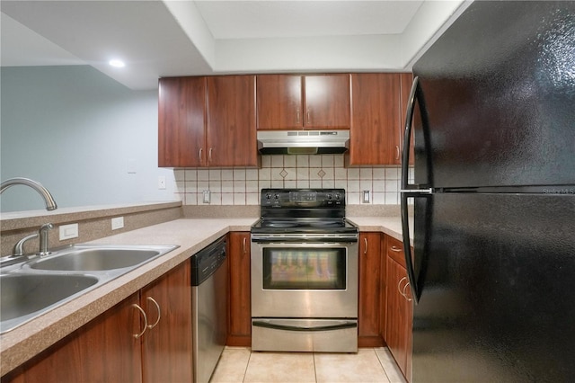 kitchen featuring sink, tasteful backsplash, appliances with stainless steel finishes, and light tile patterned flooring