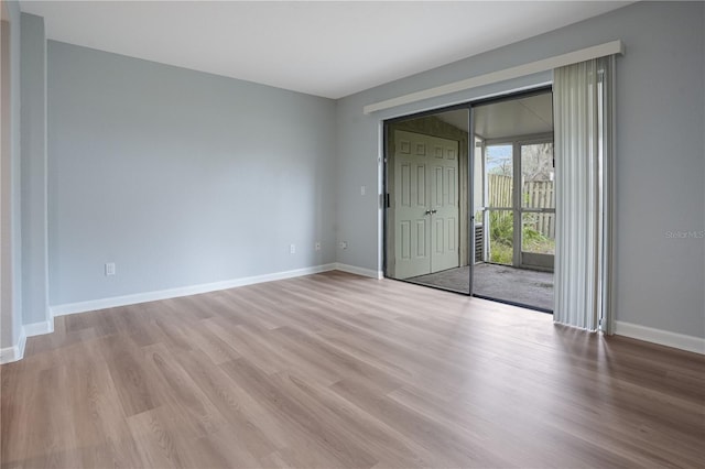 spare room featuring light hardwood / wood-style flooring