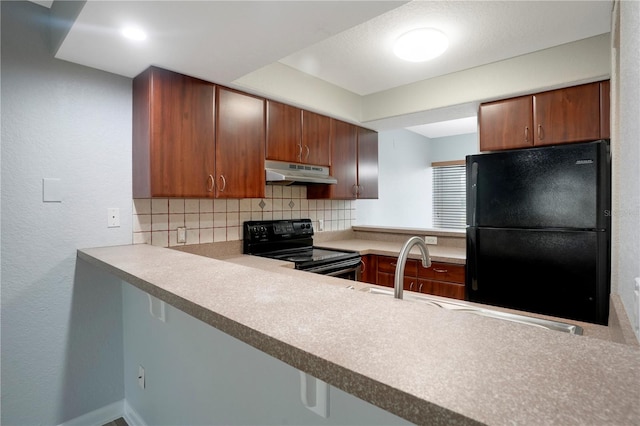 kitchen featuring backsplash, black appliances, and sink