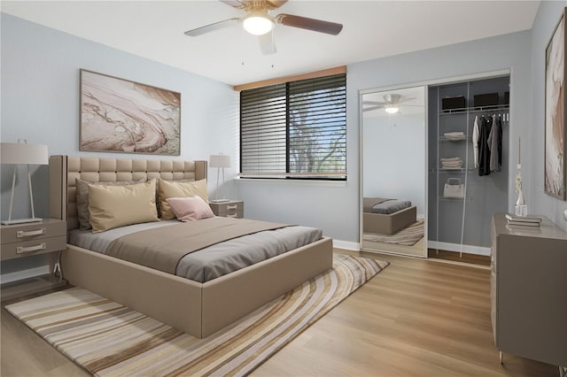 bedroom with a closet, ceiling fan, and light hardwood / wood-style floors