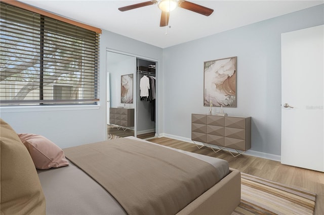 bedroom featuring a closet, wood-type flooring, and ceiling fan