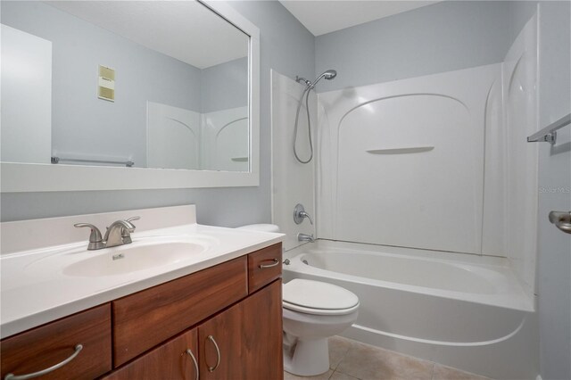 full bathroom with vanity, toilet, tile patterned floors, and shower / bathtub combination