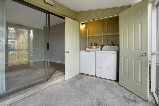 laundry room featuring washing machine and clothes dryer