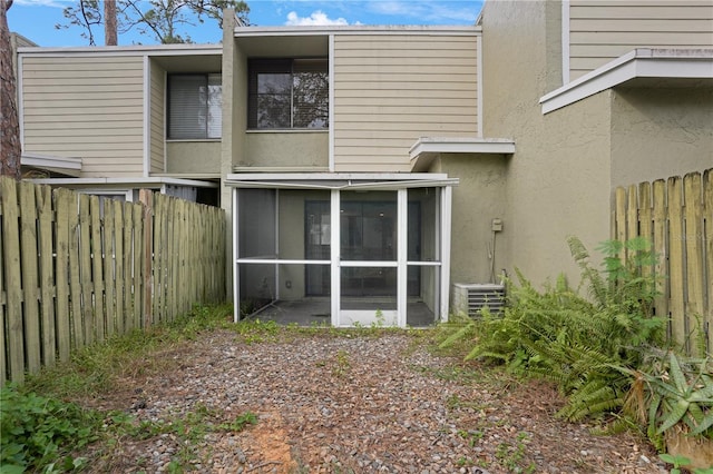 back of property featuring a sunroom