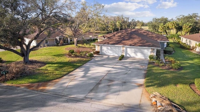 view of front facade with a front yard and a garage