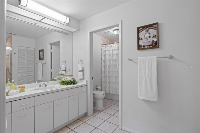 bathroom featuring vanity, a shower with shower curtain, toilet, and tile patterned floors