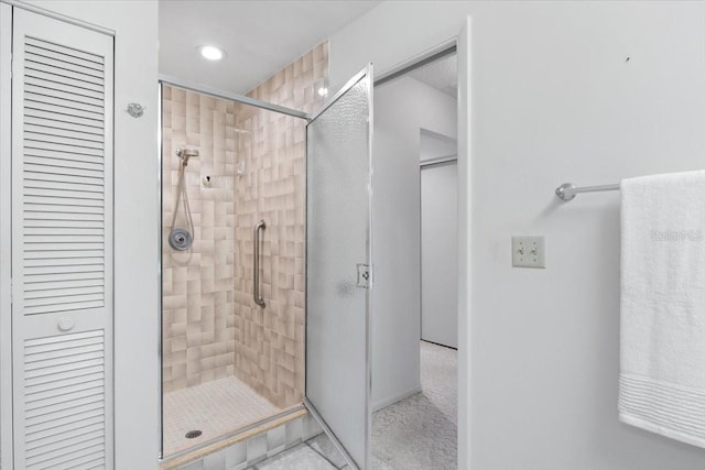 bathroom with a shower with shower door