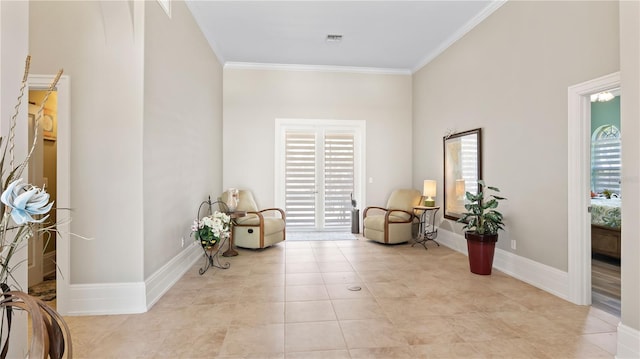 living area with crown molding