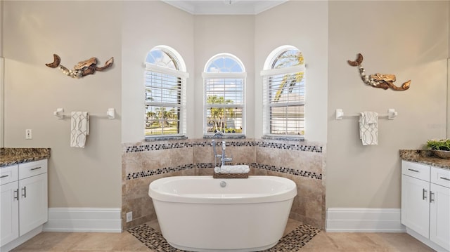 bathroom with tile walls, vanity, and a bathtub