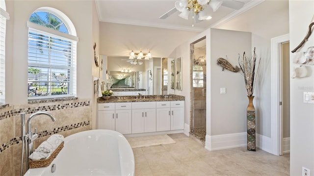 bathroom with tile patterned floors, vanity, ceiling fan, crown molding, and a bath