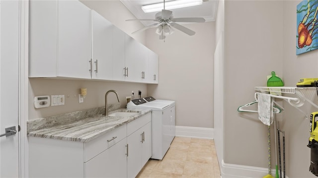 laundry area featuring cabinets, ceiling fan, sink, and independent washer and dryer