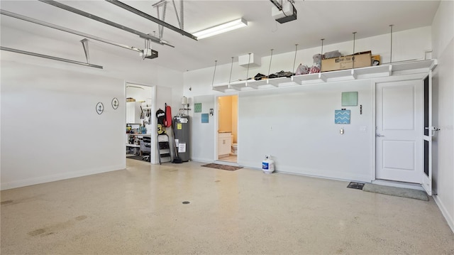 garage featuring a garage door opener and water heater