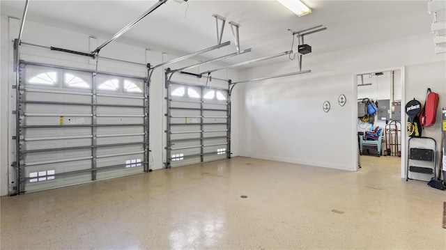 garage with electric panel and a garage door opener