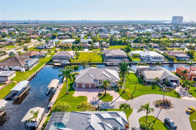 birds eye view of property with a water view