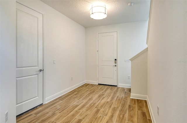 interior space with a textured ceiling