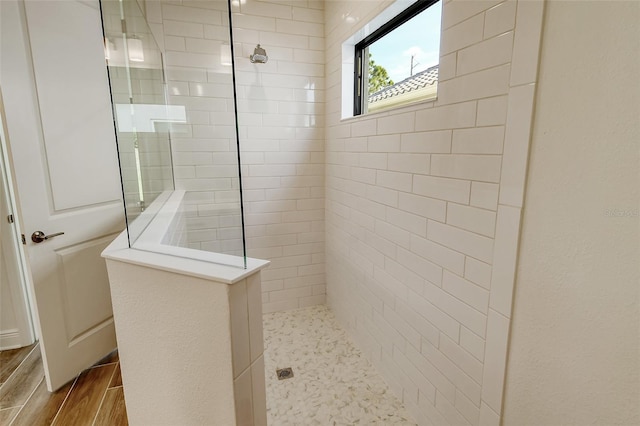 bathroom with tiled shower