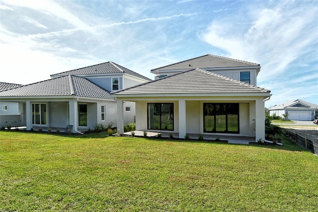 back of house featuring a yard