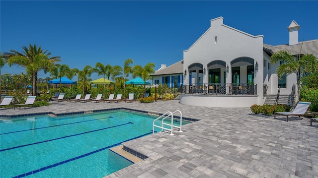 view of pool featuring a patio