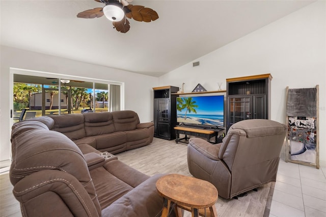 living room with light hardwood / wood-style flooring, high vaulted ceiling, and ceiling fan