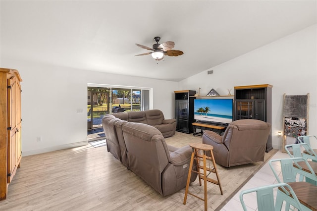 living room featuring lofted ceiling, light hardwood / wood-style flooring, and ceiling fan