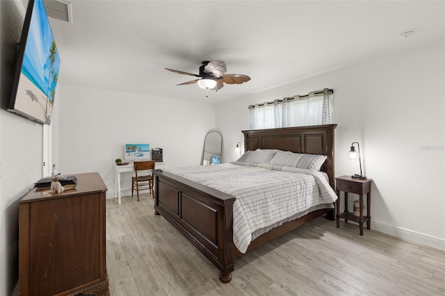 bedroom with light hardwood / wood-style floors and ceiling fan