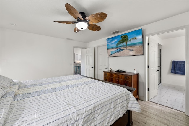 bedroom with light wood-type flooring and ceiling fan