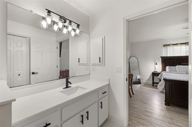 bathroom with vanity and hardwood / wood-style floors