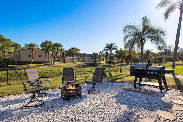 view of yard with an outdoor fire pit