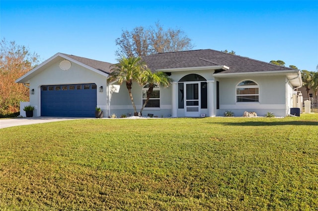 single story home with a front yard and a garage