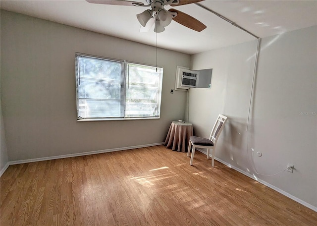 1570 Pleasant Rd Unit J-26, Bradenton, FL 34207 - unfurnished room with a wall mounted air conditioner, ceiling fan, and light wood-type flooring