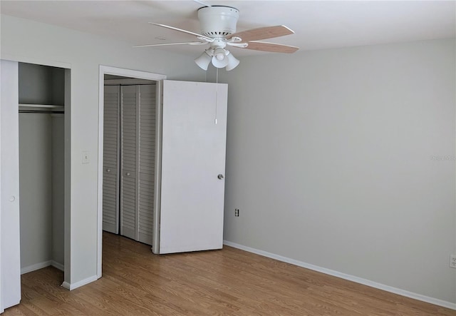 1570 Pleasant Rd Unit J-26, Bradenton, FL 34207 - unfurnished bedroom with multiple closets, ceiling fan, and light hardwood / wood-style floors