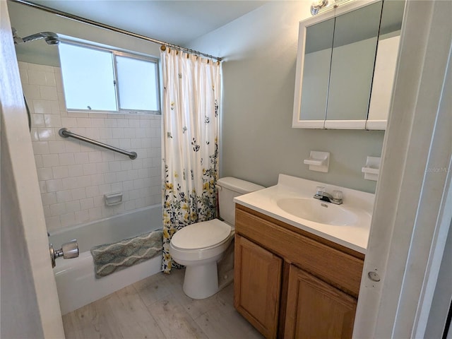 1570 Pleasant Rd Unit J-26, Bradenton, FL 34207 - full bathroom featuring toilet, hardwood / wood-style floors, vanity, and shower / tub combo with curtain
