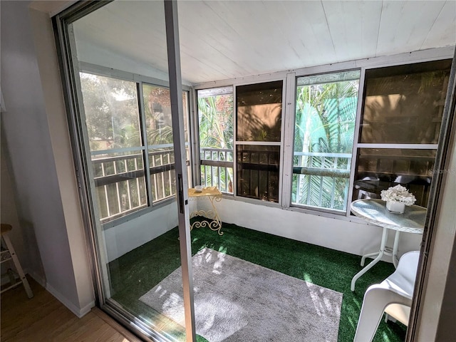 sunroom / solarium with wood ceiling