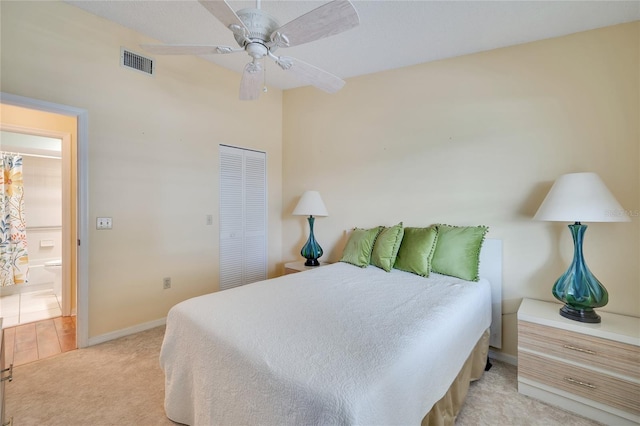 carpeted bedroom featuring a closet and ceiling fan