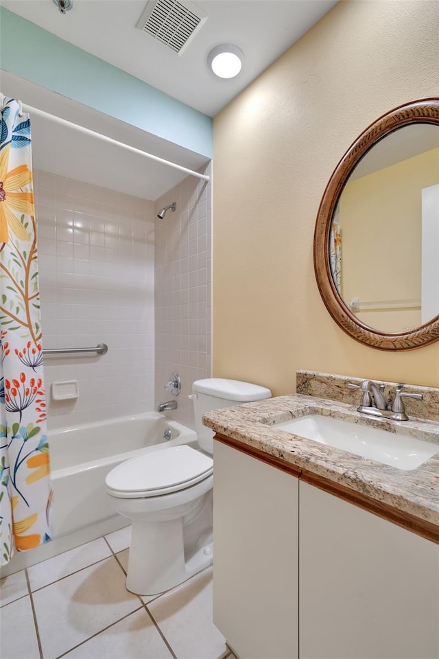 full bathroom featuring tile patterned flooring, vanity, toilet, and shower / tub combo