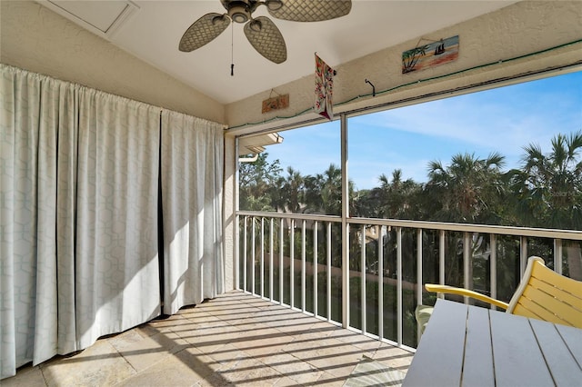 sunroom / solarium featuring ceiling fan and lofted ceiling