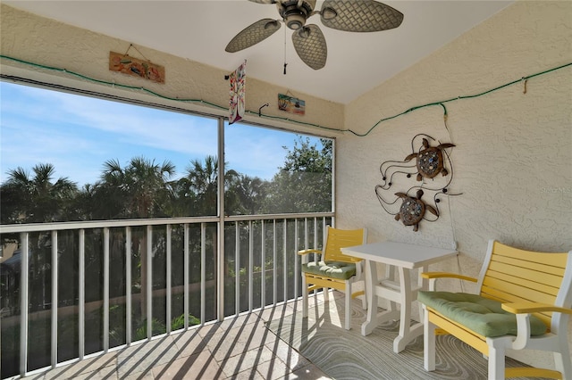 sunroom featuring ceiling fan