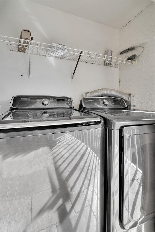 laundry area with separate washer and dryer