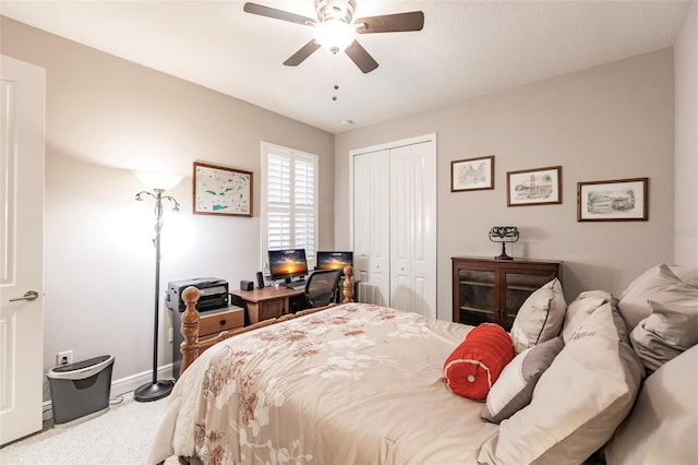 carpeted bedroom featuring ceiling fan and a closet