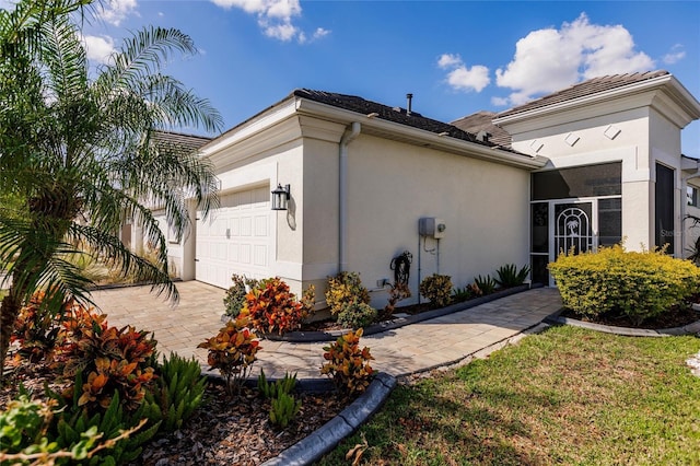 view of side of property with a garage