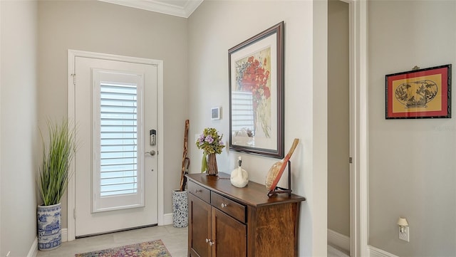 doorway featuring light tile patterned floors and ornamental molding