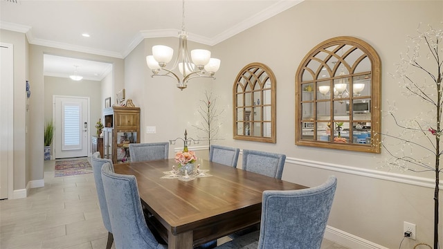 dining space with an inviting chandelier and crown molding