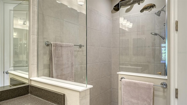 bathroom with tiled shower